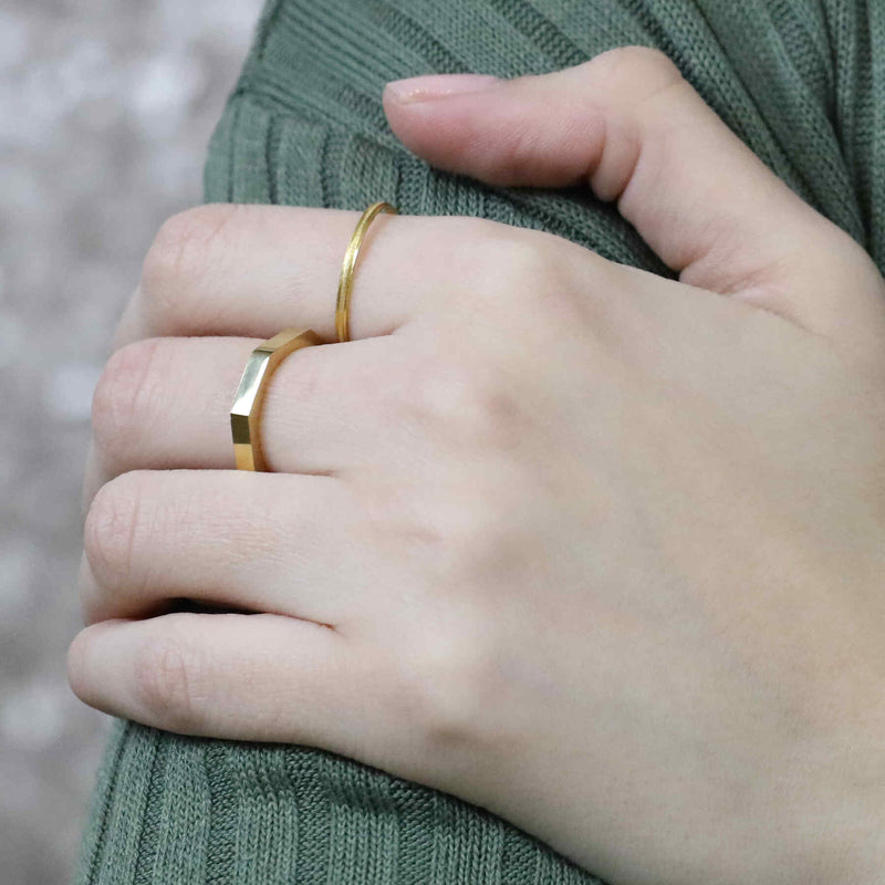 Model Wearing Beautiful Unique Modern Bolt Design Solid Gold Ring By Jewelry Lane